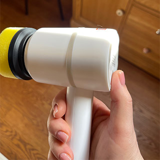 person holding HomePro Brush